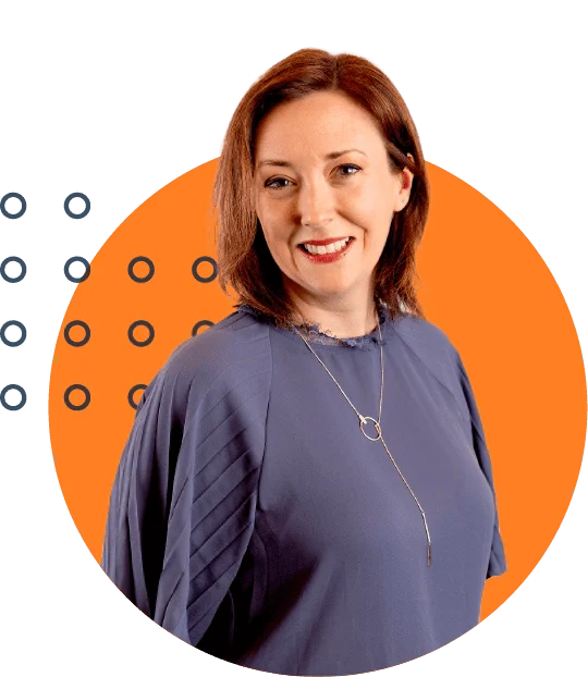 Professional businesswoman smiling, with a modern necklace and blue blouse, against an orange background with decorative circles.