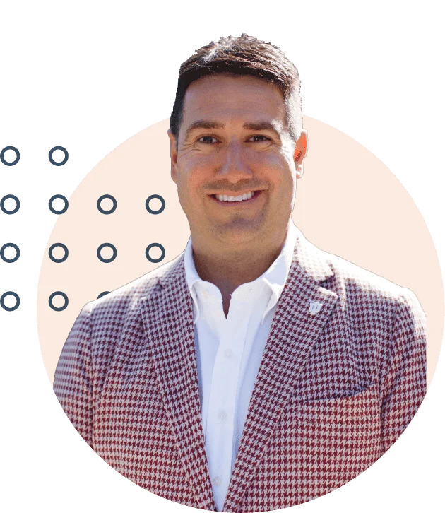 Professional man smiling in a houndstooth blazer with a white shirt, against a stylized circular background, exuding confidence and approachability.