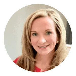 Professional smiling blonde woman in a red blouse, styled with minimalist earrings, providing a friendly, inviting appearance ideal for business profiles.