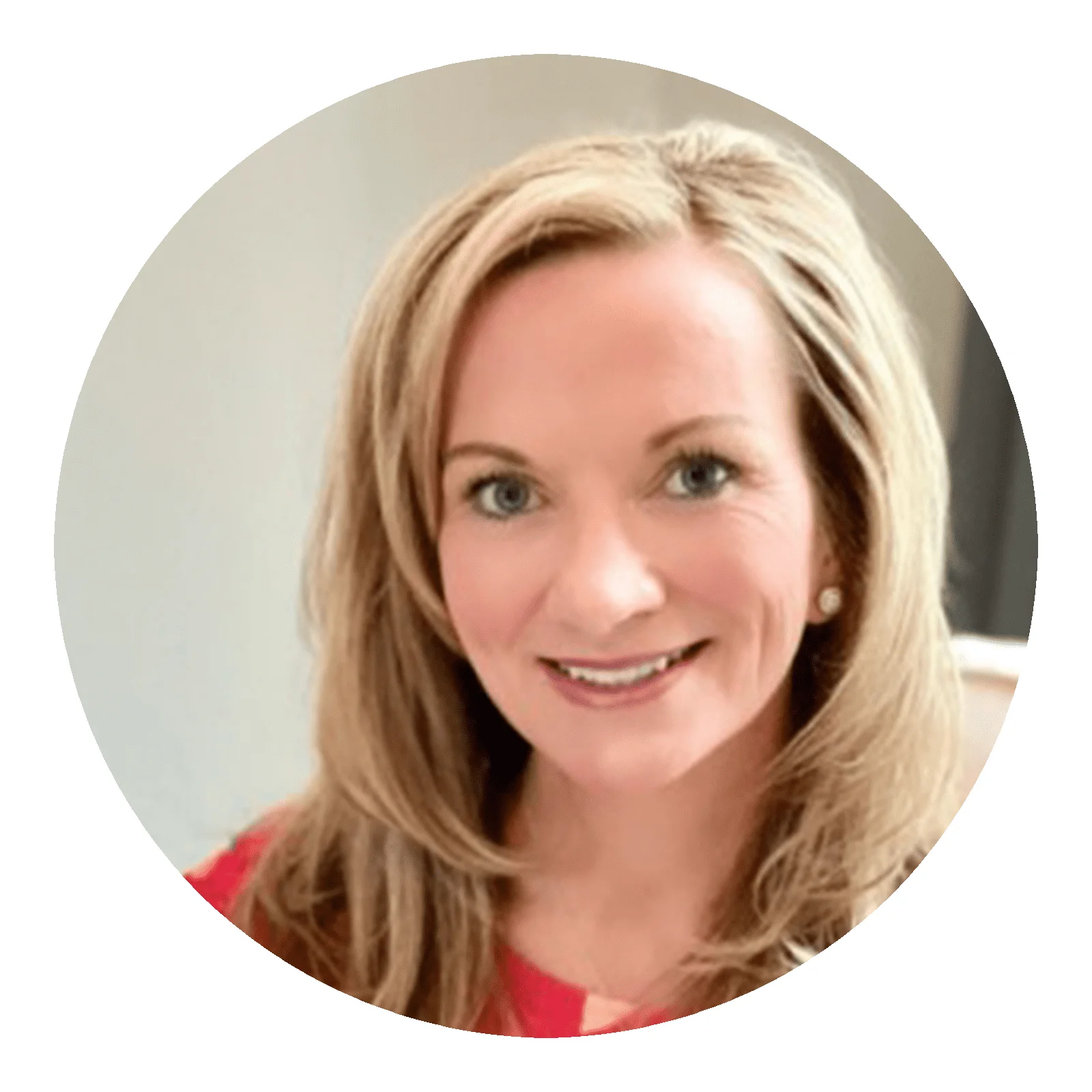 Professional smiling blonde woman in a red blouse, styled with minimalist earrings, providing a friendly, inviting appearance ideal for business profiles.