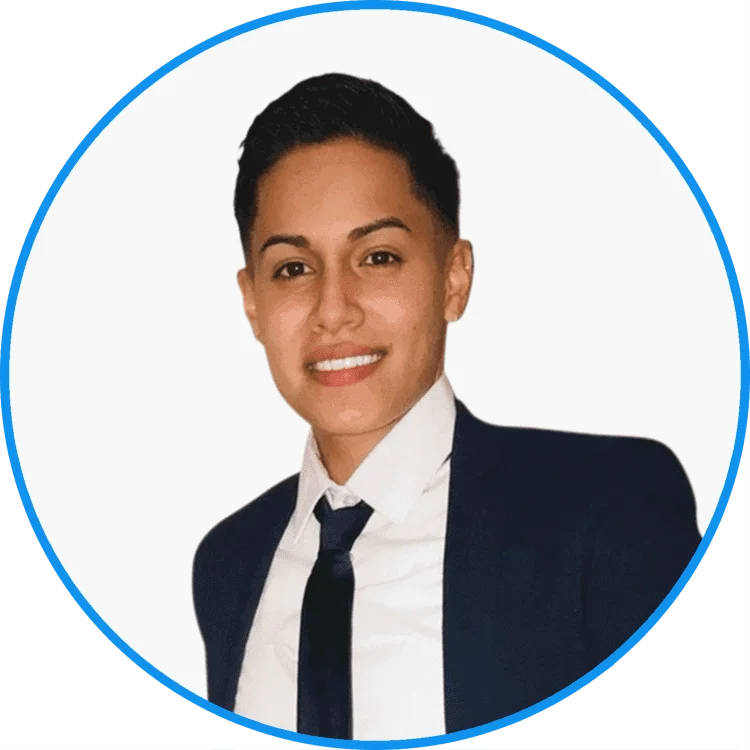 Professional young adult with a confident smile, wearing a navy suit and white shirt, isolated on a white background in a blue circle frame.