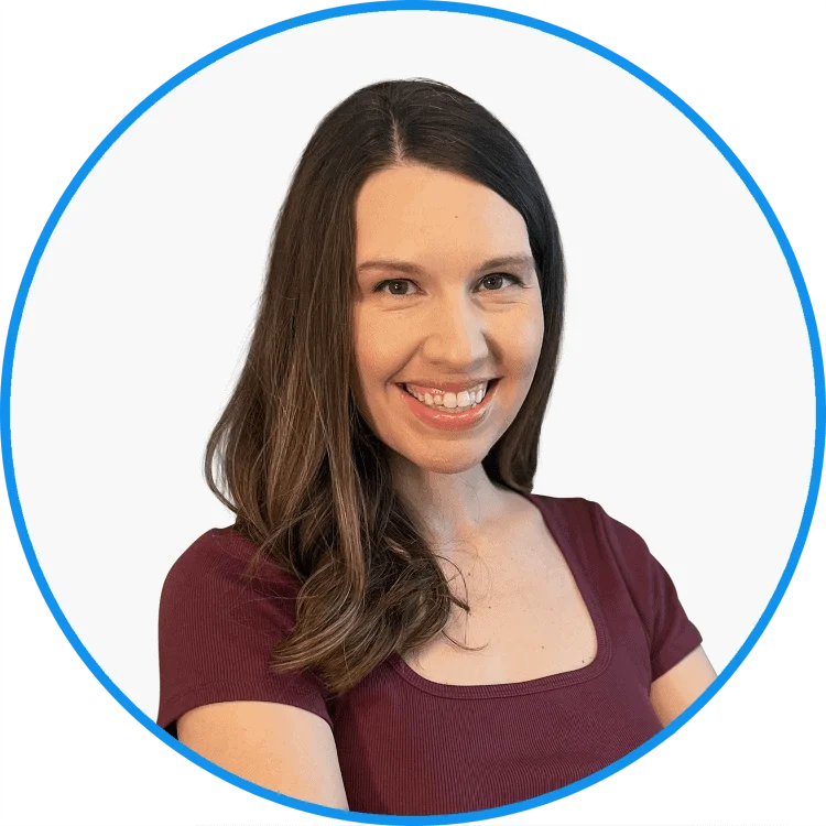 Professional headshot of a smiling woman with long brown hair, wearing a maroon top, framed in a blue circle.