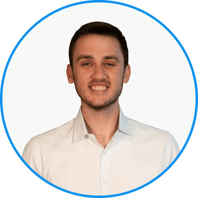 Professional young man smiling in a white shirt, isolated on a white background with blue circular border.