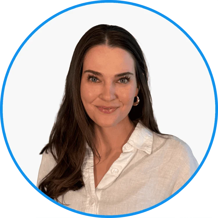 Professional portrait of a smiling brunette woman with clear skin, wearing a white blouse and hoop earrings, encircled by a blue outline.